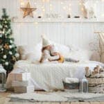 Cozy,Little,Sisters,Are,Hugging,On,The,Bed,In,White